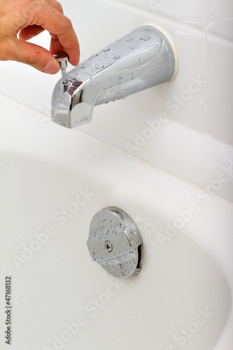 Photo: Demonstration of how the water tap is working in a bathroom Demonstration of how the water tap is working in a bathroom