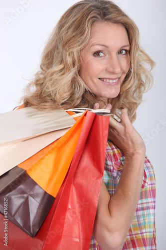 Photo: Woman holding two shopping bags Woman holding two shopping bags