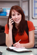 Brunette woman answering the phone