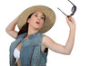 Young woman with straw hat and sunglasses
