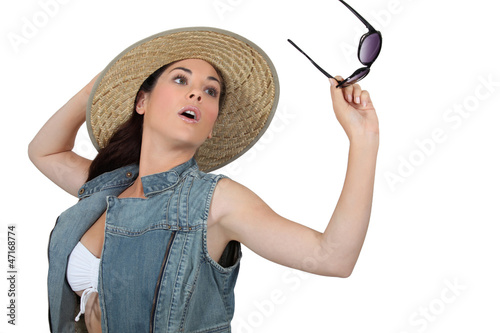 Photo: Young woman with straw hat and sunglasses Young woman with straw hat and sunglasses