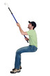 Man painting wall with roller