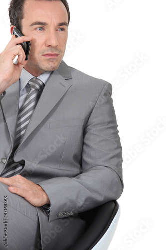 Photo: Businessman using a cellphone Businessman using a cellphone