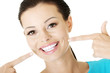 Photo: Woman showing her perfect teeth. Woman showing her perfect teeth.