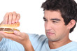 Man holding cheeseburger