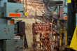 Sparks from a blowtorch in dismantling an old printing press