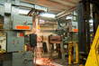 Demolition of old printing press with shower of sparks