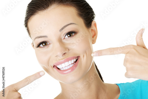 Photo: Woman showing her perfect teeth. Woman showing her perfect teeth.