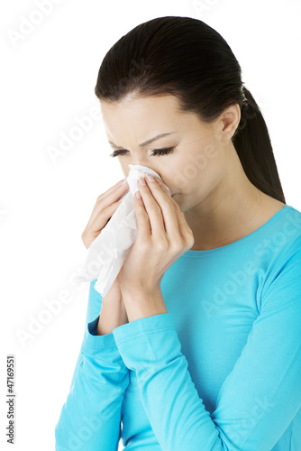 Photo: Young woman with tissue. Young woman with tissue.