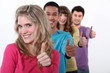 Young group of people giving the thumb's up