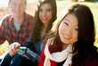 Young smiling women with friends