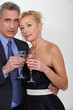 Mature couple toasting with champagne