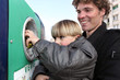 Father and son at a bottle bank