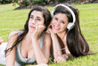 Photo: Two happy girls listening music Two happy girls listening music