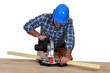 Woodworker using miter saw