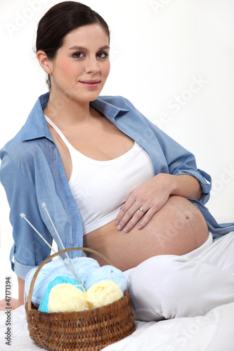 Photo: Pregnant woman knitting Pregnant woman knitting