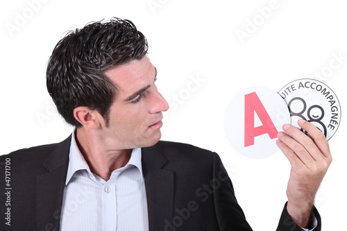 Photo: Man showing stickers Man showing stickers