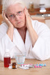 Grumpy woman taking her medication