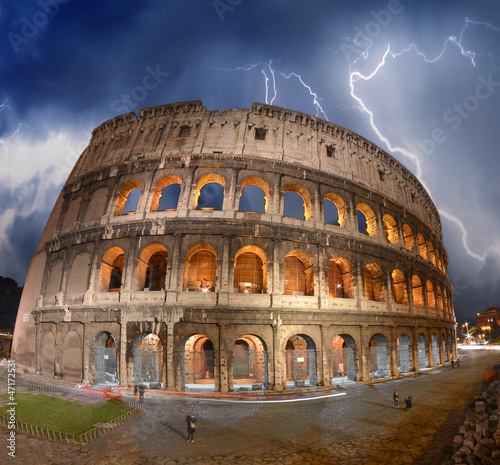Photo: Beautiful dramatic sky over Colosseum in Rome Beautiful dramatic sky over Colosseum in Rome