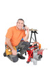 plumber on the phone kneeling