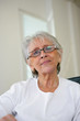 Elderly lady relaxing at home