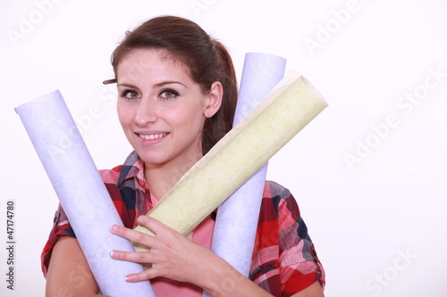 Photo: Woman with paper rolls Woman with paper rolls