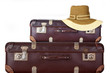Old suitcase with women's hat