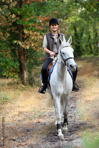 Photo: Young girl horseriding Young girl horseriding