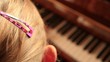 girl playing the piano