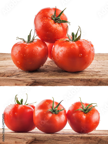 Photo: Collection of Tomatoes on the old wooden board with water drops Collection of Tomatoes on the old wooden board with water drops