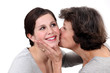 Mother kissing her daughter