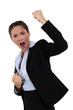 successful businesswoman screaming and raising hands