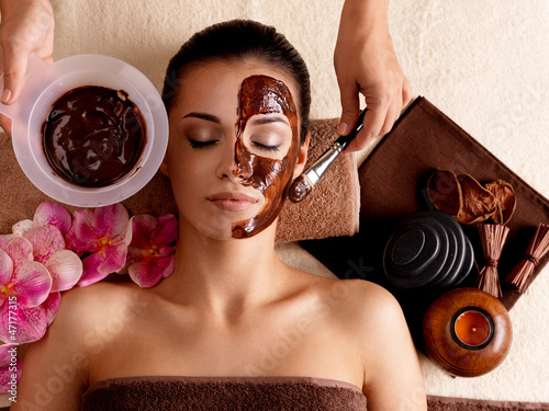 Photo: Spa therapy for woman receiving cosmetic mask Spa therapy for woman receiving cosmetic mask