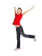 Happy boy jumping with raised hands up