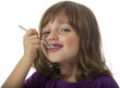 Photo: little girl eating a yogurt close up little girl eating a yogurt close up