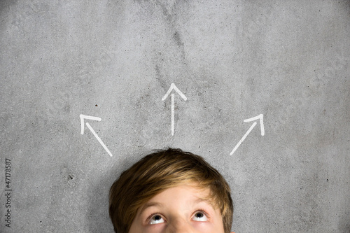 Photo: Child looks upwards Child looks upwards