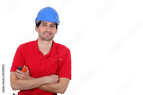 Photo: Man holding tape measure Man holding tape measure