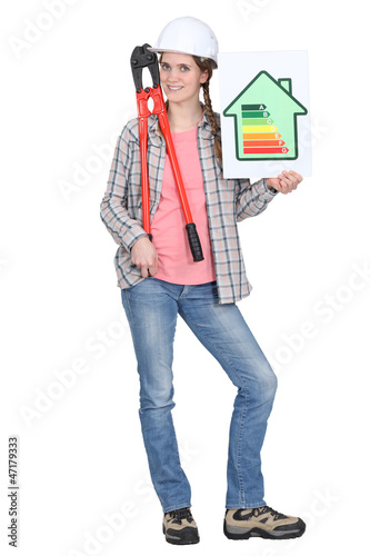 Photo: Tradeswoman holding oversized pliers Tradeswoman holding oversized pliers