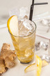 Yellow drink with pears, ginger and ice