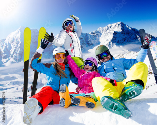 Photo: Ski, snow, sun and winter fun - happy family ski team Ski, snow, sun and winter fun - happy family ski team