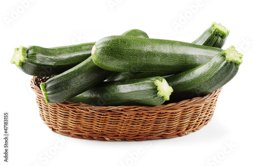 Photo: zucchini in basket isolated zucchini in basket isolated