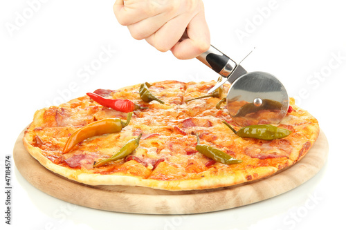 Photo: cutting tasty pepperoni pizza on wooden stand isolated on white cutting tasty pepperoni pizza on wooden stand isolated on white