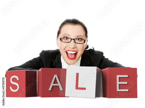 Photo: Businesswoman with sale sign Businesswoman with sale sign