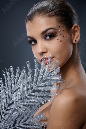 Photo: Seductive woman with silver fan Seductive woman with silver fan