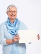 Smiling old lady with blank sheet
