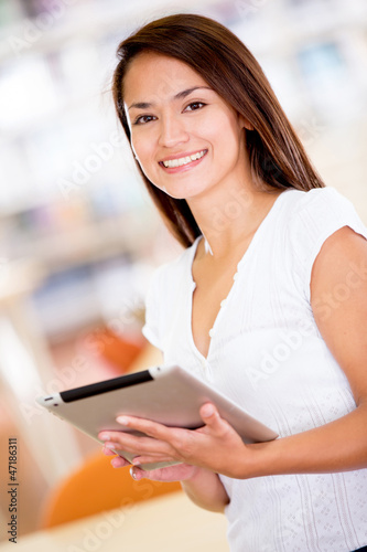 Photo: Woman with an e-book reader Woman with an e-book reader