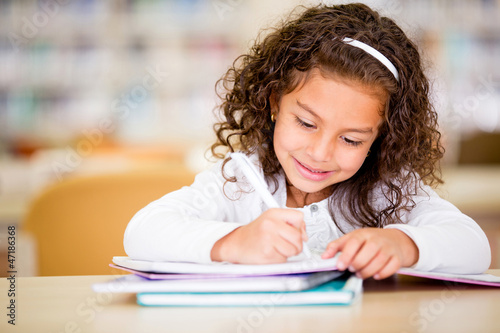 Photo: Girl studying at school Girl studying at school
