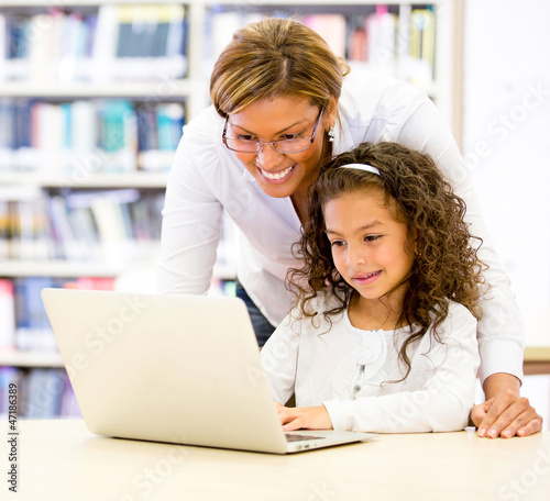 Photo: ICT teacher with a student ICT teacher with a student