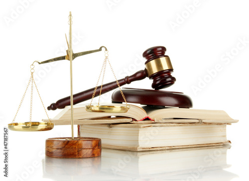 Photo: Golden scales of justice, gavel and books isolated on white Golden scales of justice, gavel and books isolated on white