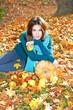 Happy young pretty woman at the autumn  park.